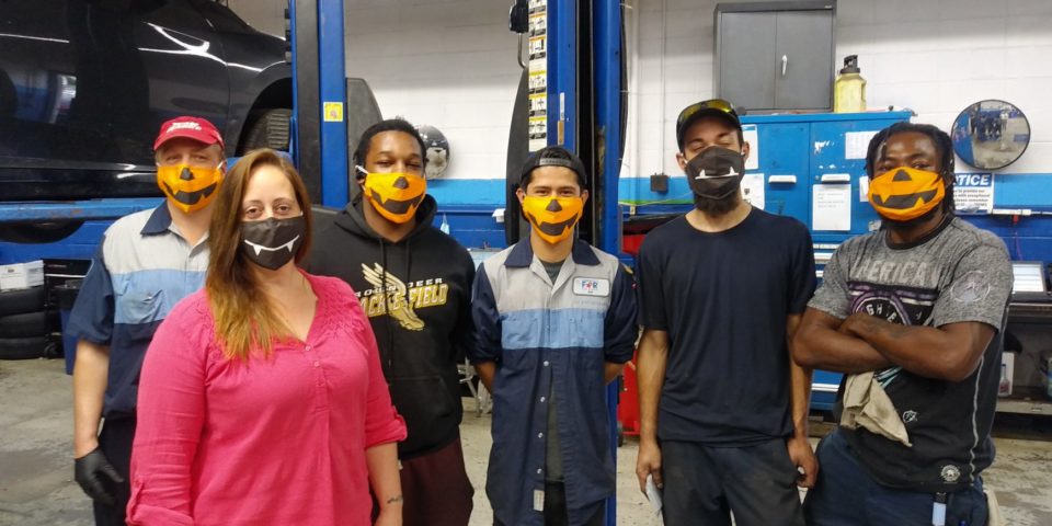 David Hobbs Honda employees wearing Halloween face masks