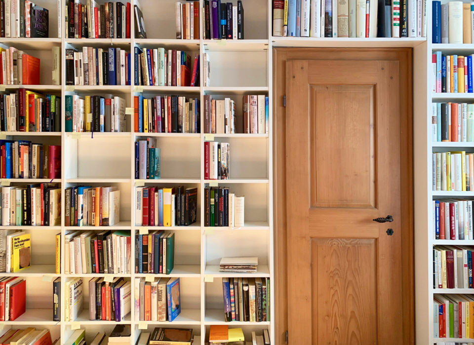 White book shelves with empty parts