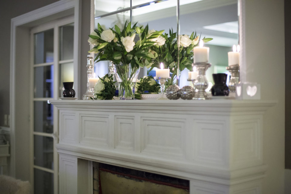 Flowers on a marble fireplace mantel