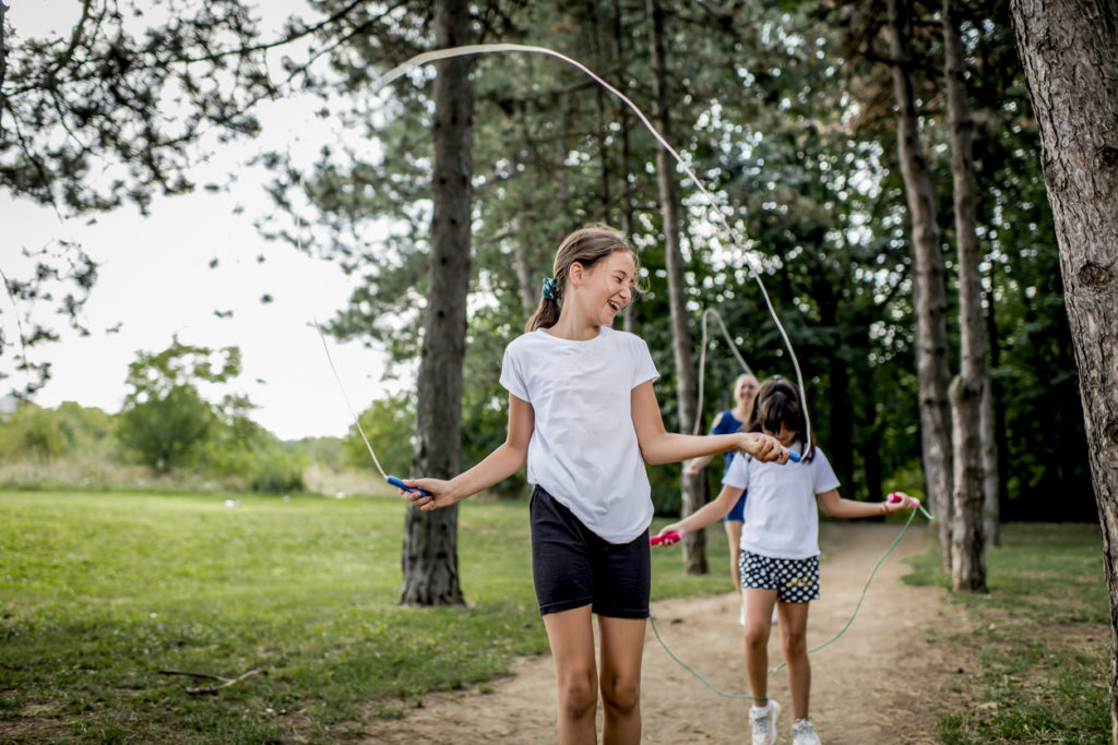 Kids jumping rope in the park