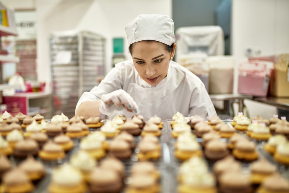 Low angle view of focused baker