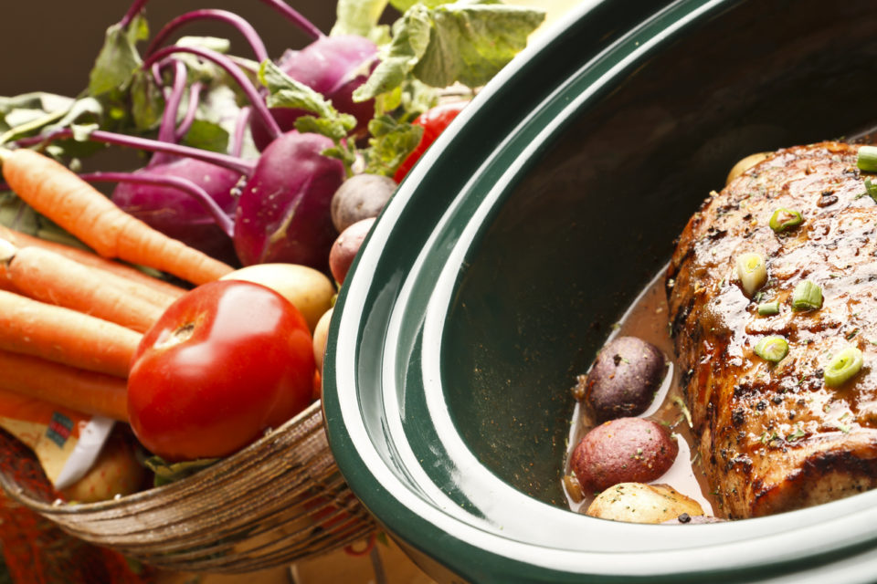 vegetables and meat in a crock pot slow cooker