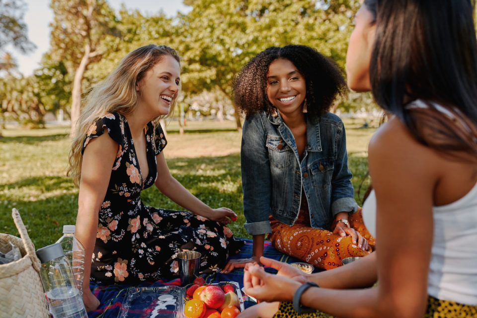 friends enjoying a picnic in the park