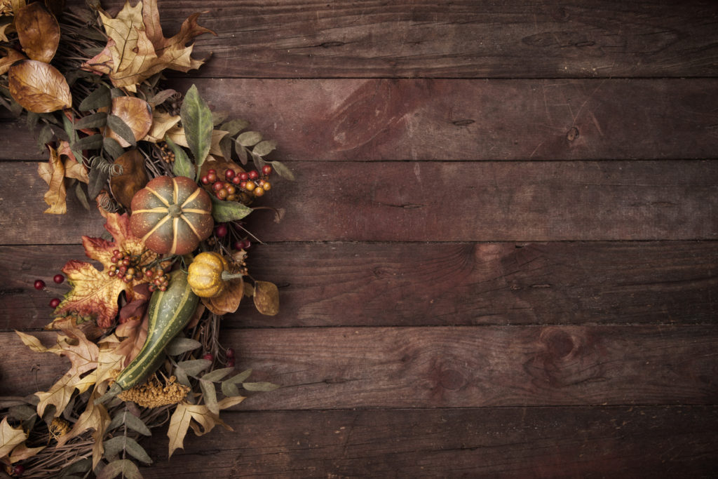 Thanksgiving autumn wreath on an old wood background