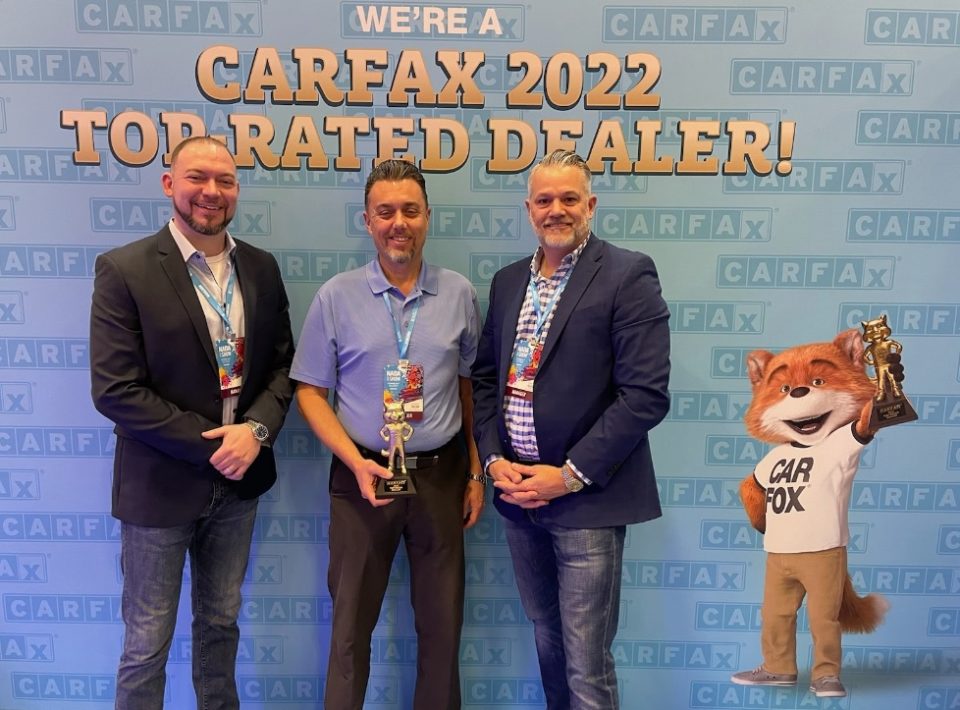 Brad, Jeremy and Darrin accepting the 2022 CarFax Top-Rated Lifetime Dealer award